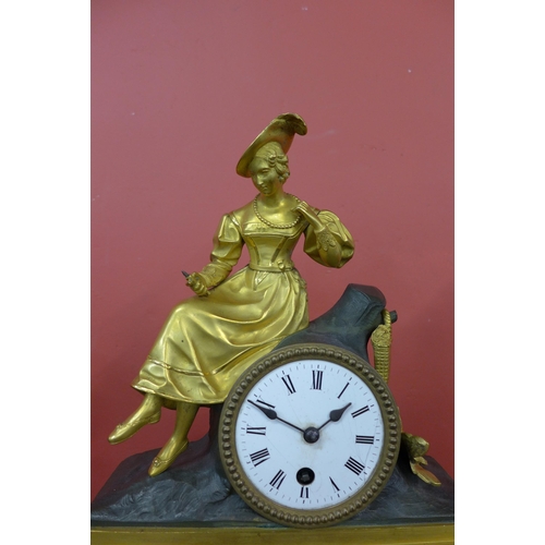 1 - A 19th Century French glass domed gilt metal mantel clock, on ebonised stand