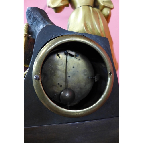 1 - A 19th Century French glass domed gilt metal mantel clock, on ebonised stand