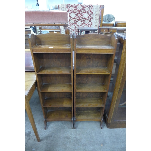 110 - A pair of Edward VII oak open bookcases