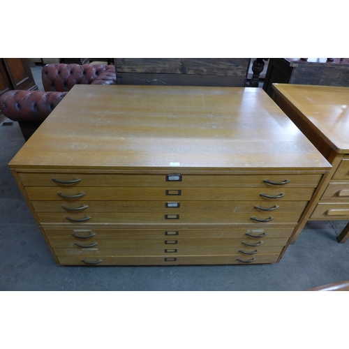 127 - A light oak plan chest