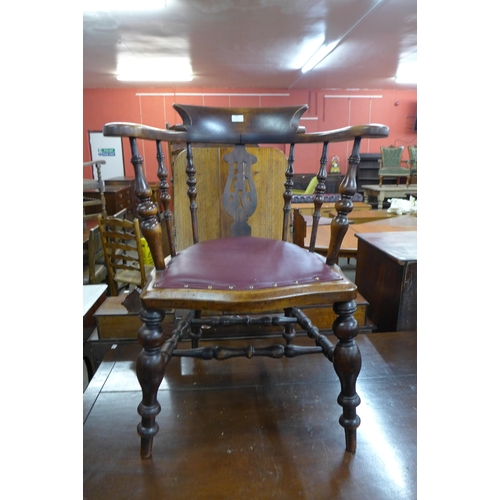 132 - A Victorian elm and mahogany desk chair