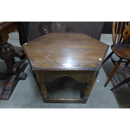 135 - A carved Ipswich oak octagonal coffee table