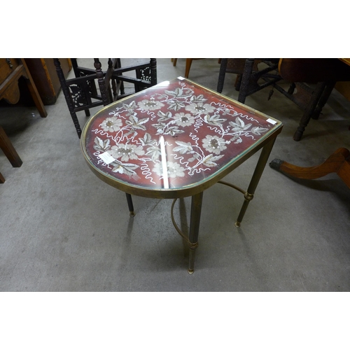 153 - An Italian brass D-shaped occasional table, with embroidered inset top