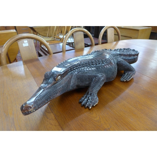 16 - A carved softwood Cayman, 82cms l