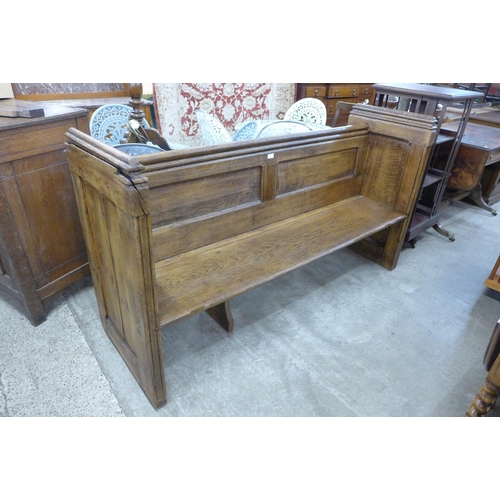 174 - A Victorian carved oak linenfold church pew