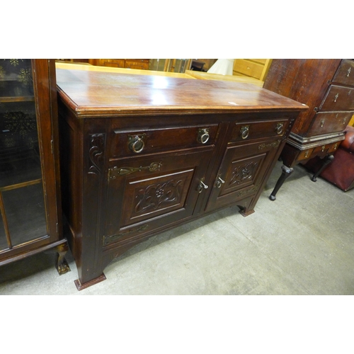 182 - An Arts and Crafts mahogany sideboard