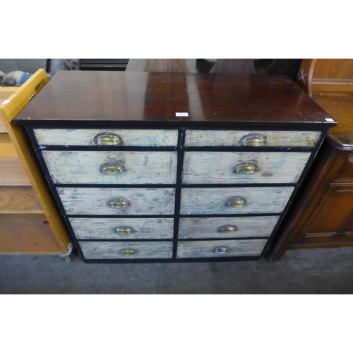 202 - A painted pine and beech chest of drawers