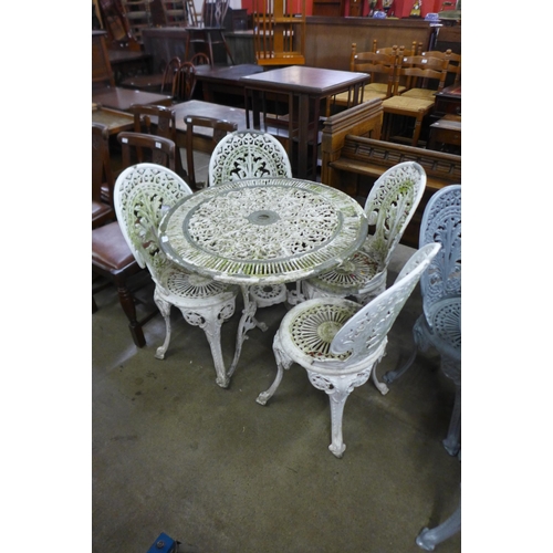 251 - A painted cast aluminium garden table and four chairs