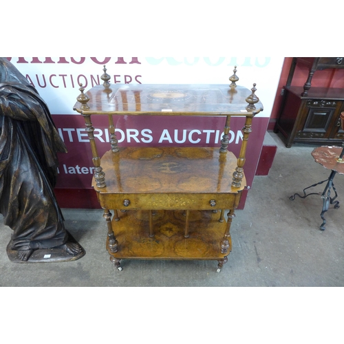 27 - A Victorian inlaid burr walnut three tier whatnot