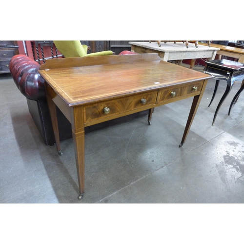 38 - An Edward VII inlaid mahogany two drawer writing table