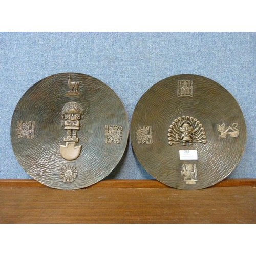 381 - A pair of copper Aztec style wall hanging plaques, 25cms d