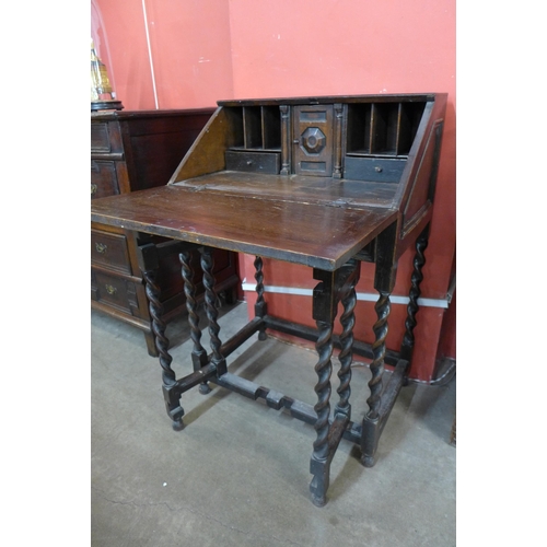 45 - A Victorian Jacobean Revival oak geometric moulded barleytwist bureau