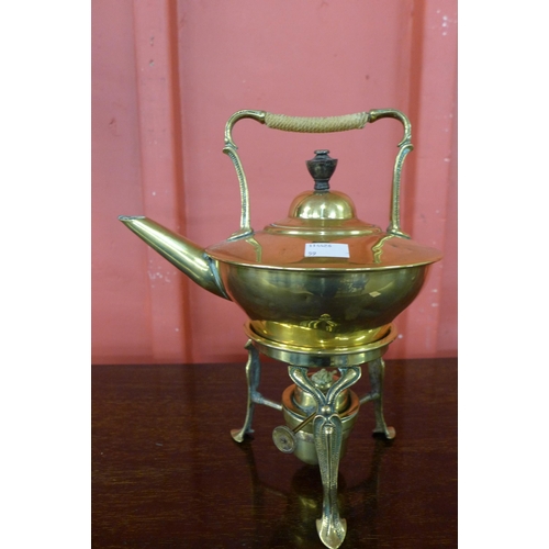 6 - An Arts and Crafts brass spirit kettle on stand