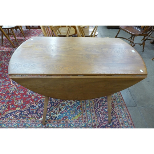 62 - An Ercol Blonde elm and beech Windsor drop-leaf table