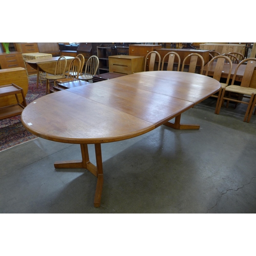 67 - A Danish teak extending dining table