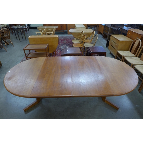 67 - A Danish teak extending dining table