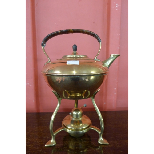 7 - An Arts and Crafts W.A.S Benson brass spirit kettle on stand