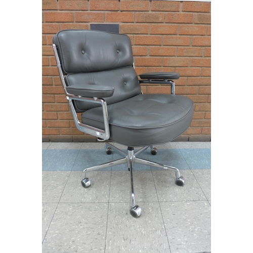 79 - A 2008 Vitra chrome and grey leather ES104 revolving desk chair, designed by Charles Eames