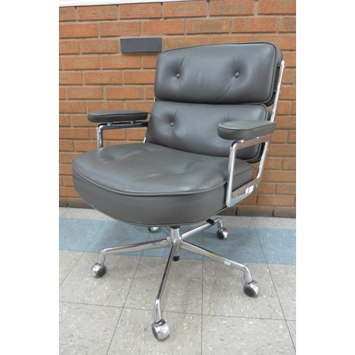 79 - A 2008 Vitra chrome and grey leather ES104 revolving desk chair, designed by Charles Eames