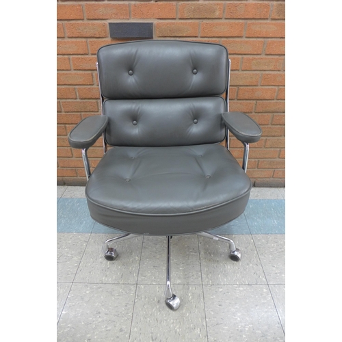 79 - A 2008 Vitra chrome and grey leather ES104 revolving desk chair, designed by Charles Eames