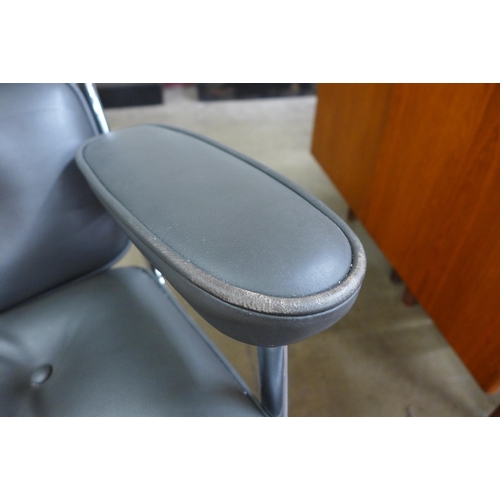 79 - A 2008 Vitra chrome and grey leather ES104 revolving desk chair, designed by Charles Eames