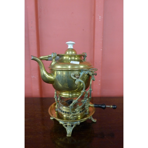 8 - An Arts and Crafts brass spirit kettle on stand