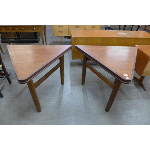 81 - A pair of Danish teak triangular side tables