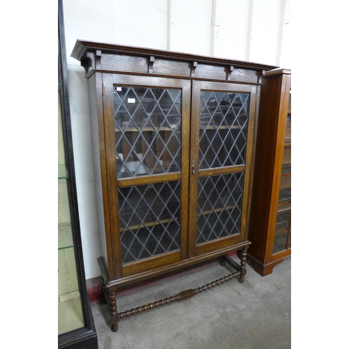 98 - An oak barleytwist two door bookcase