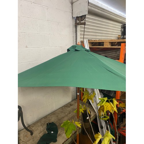 2303 - Green fabric and tear Parasol in bag