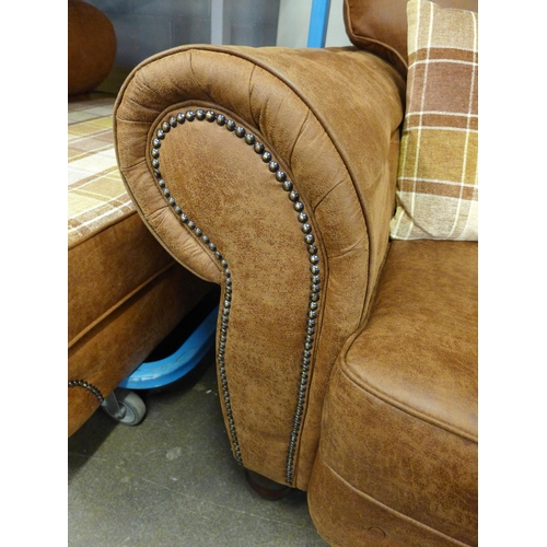 1461 - A County tan upholstered and studded love seat* this lot is subject to VAT