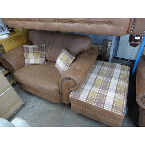 1461 - A County tan upholstered and studded love seat* this lot is subject to VAT