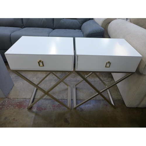 1443 - A pair of white bedside tables with cross legs