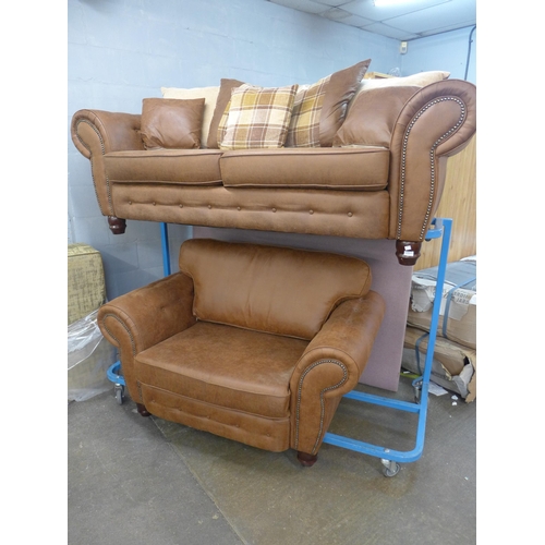 1455 - A County tan upholstered and studded three seater and loveseat * this lot is subject to VAT