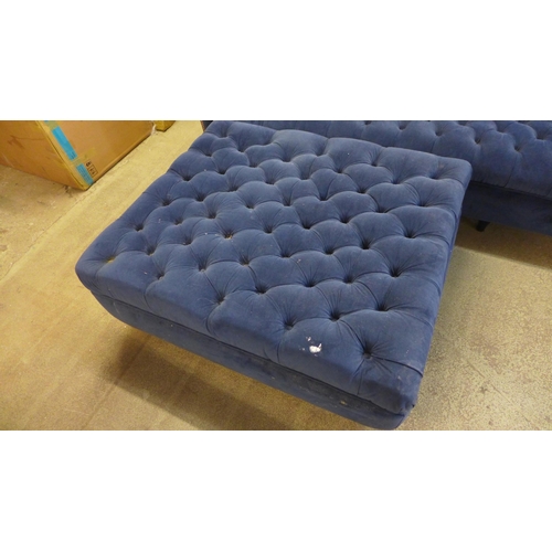 1493 - A blue velvet four seater sofa and footstool