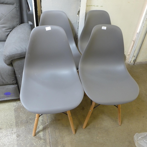 1572 - A set of four grey Eames style chairs