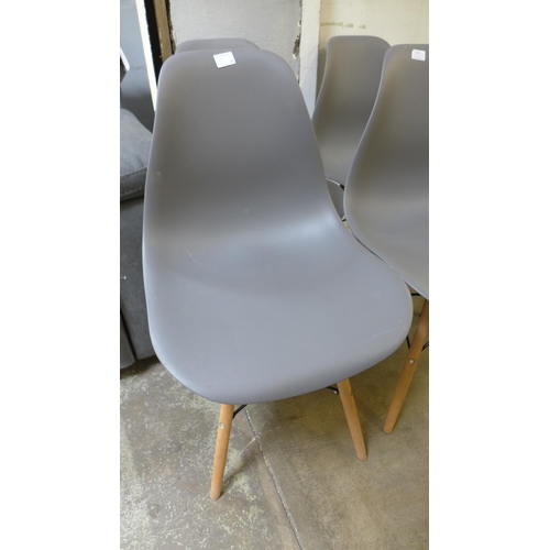 1572 - A set of four grey Eames style chairs