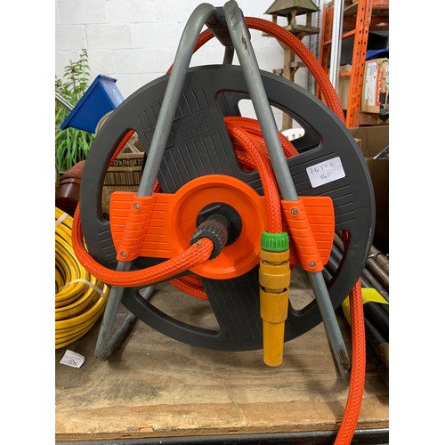 2121 - Black and Decker hose pipe and reel with other hose pipe