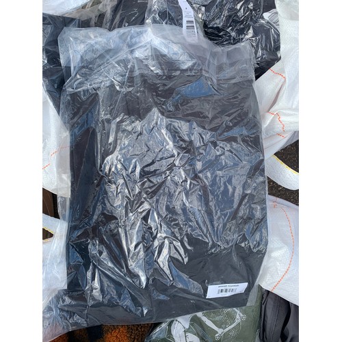 2135 - Two large bags, approx 100+items of assorted clothing, sealed T-shirts, gilets, trousers, etc.