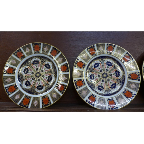 602 - Four Royal Crown Derby 1128 Imari pattern plates, 27cm