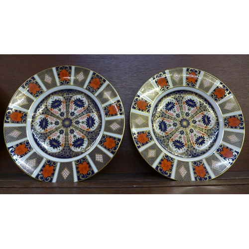 602 - Four Royal Crown Derby 1128 Imari pattern plates, 27cm