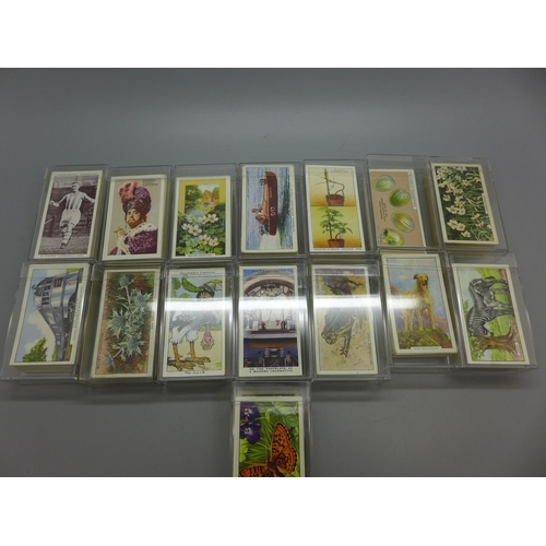 623 - Fifteen sets of cigarette cards