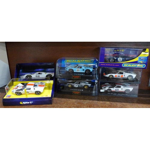 657 - Six GT40 slot racing cars, four Scalextric and two Fly Car models