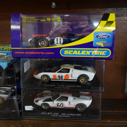 657 - Six GT40 slot racing cars, four Scalextric and two Fly Car models