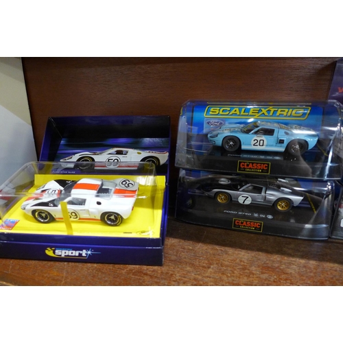 657 - Six GT40 slot racing cars, four Scalextric and two Fly Car models