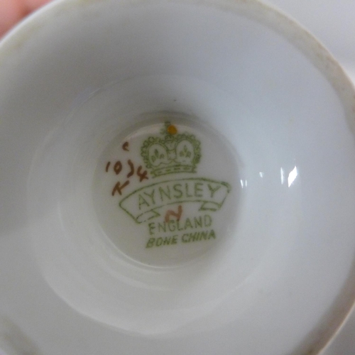 660A - Four Aynsley transfer printed cups and five Aynsley saucers, (3+2), and six Royal Albert cups, sauce... 