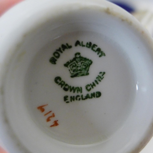 660A - Four Aynsley transfer printed cups and five Aynsley saucers, (3+2), and six Royal Albert cups, sauce... 