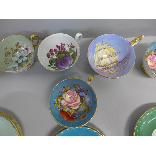 660B - A collection of Aynsley cups and saucers including D Jones and L D Bailey