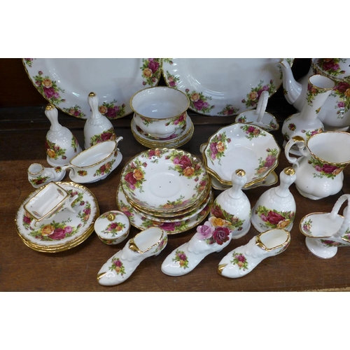 665 - Royal Albert Old Country Roses including tea pot, jugs, bells, dishes, dinner plates, vase, ornament... 