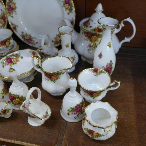 665 - Royal Albert Old Country Roses including tea pot, jugs, bells, dishes, dinner plates, vase, ornament... 