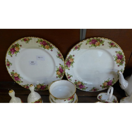 665 - Royal Albert Old Country Roses including tea pot, jugs, bells, dishes, dinner plates, vase, ornament... 